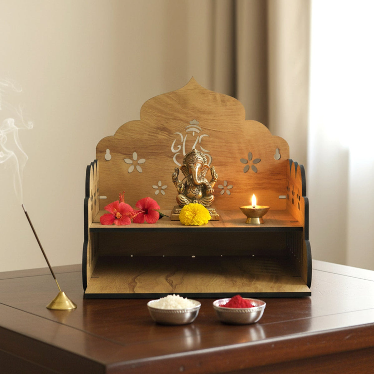 Wooden home mandir with idols placed on the base