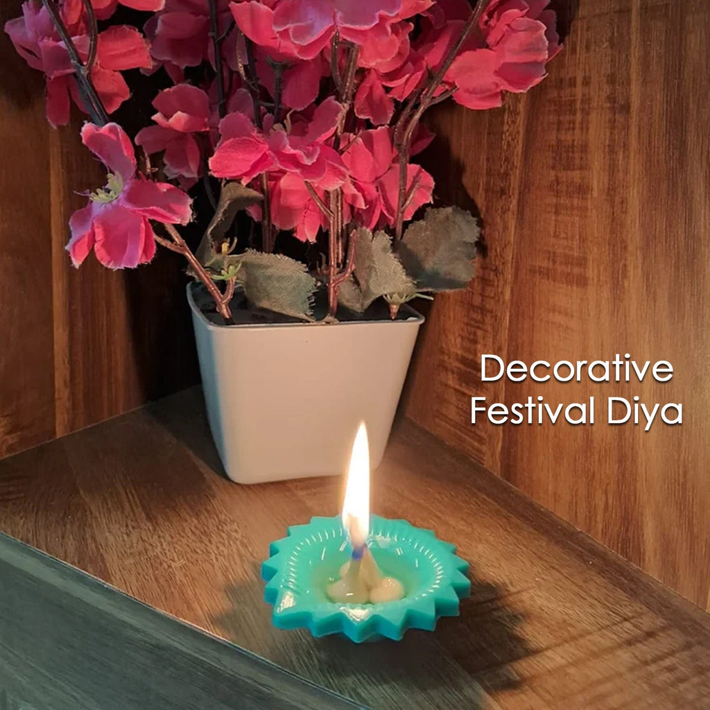 Silicone diya glowing against a dark background