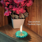 Silicone diya glowing against a dark background