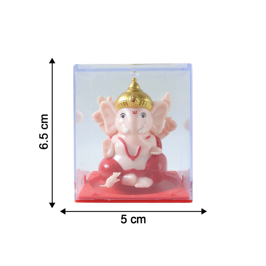 Ganesha idol in glass case with festive lights